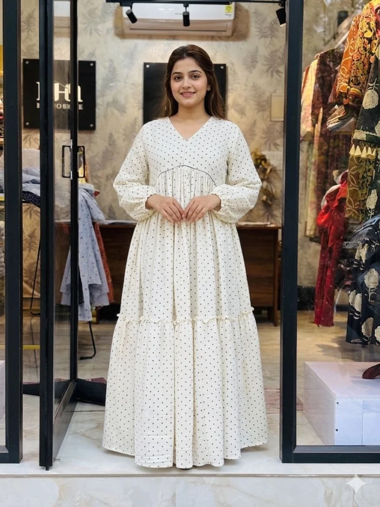 a women wearing two layer polka dot maternity gown -online maternity wear in kerala