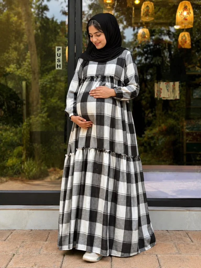 pregnanat women wearing a two layer maternity gown in outside -online maternity wear in kerala