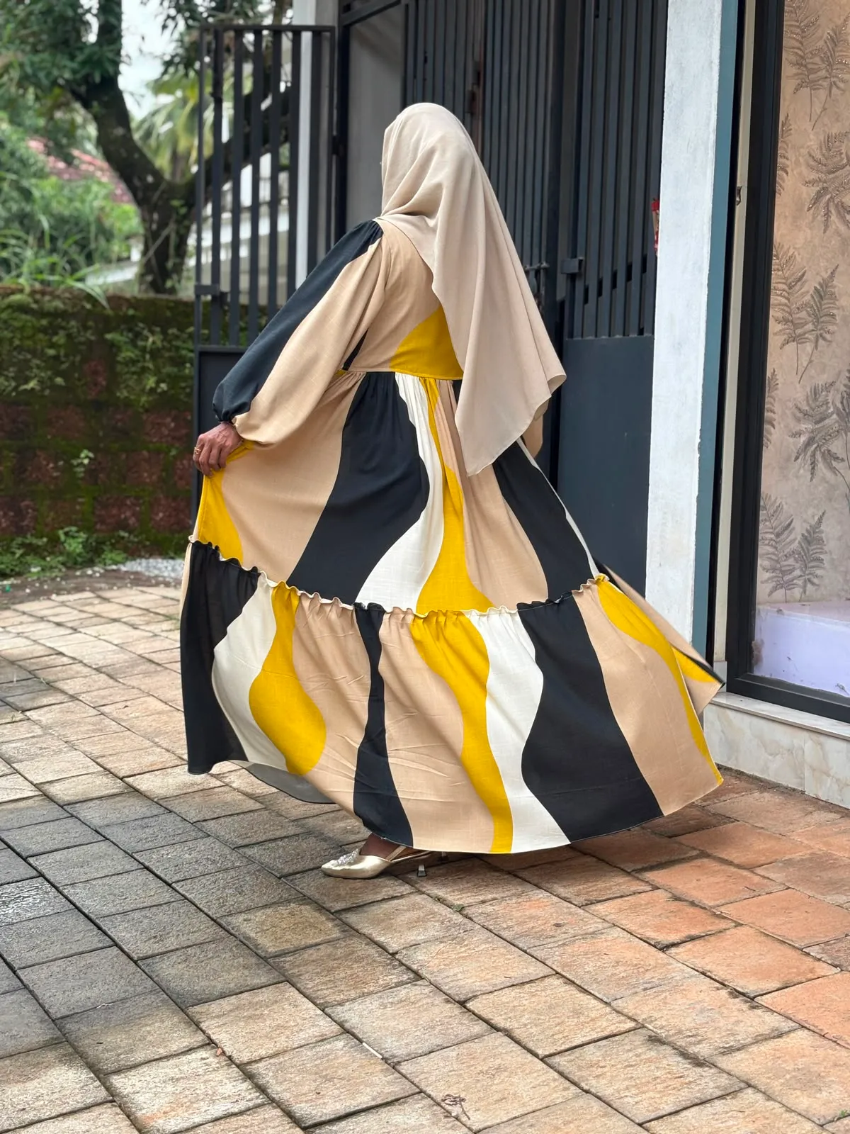 A Women wearing two layer luxury maternity gown online maternity wear in kerala