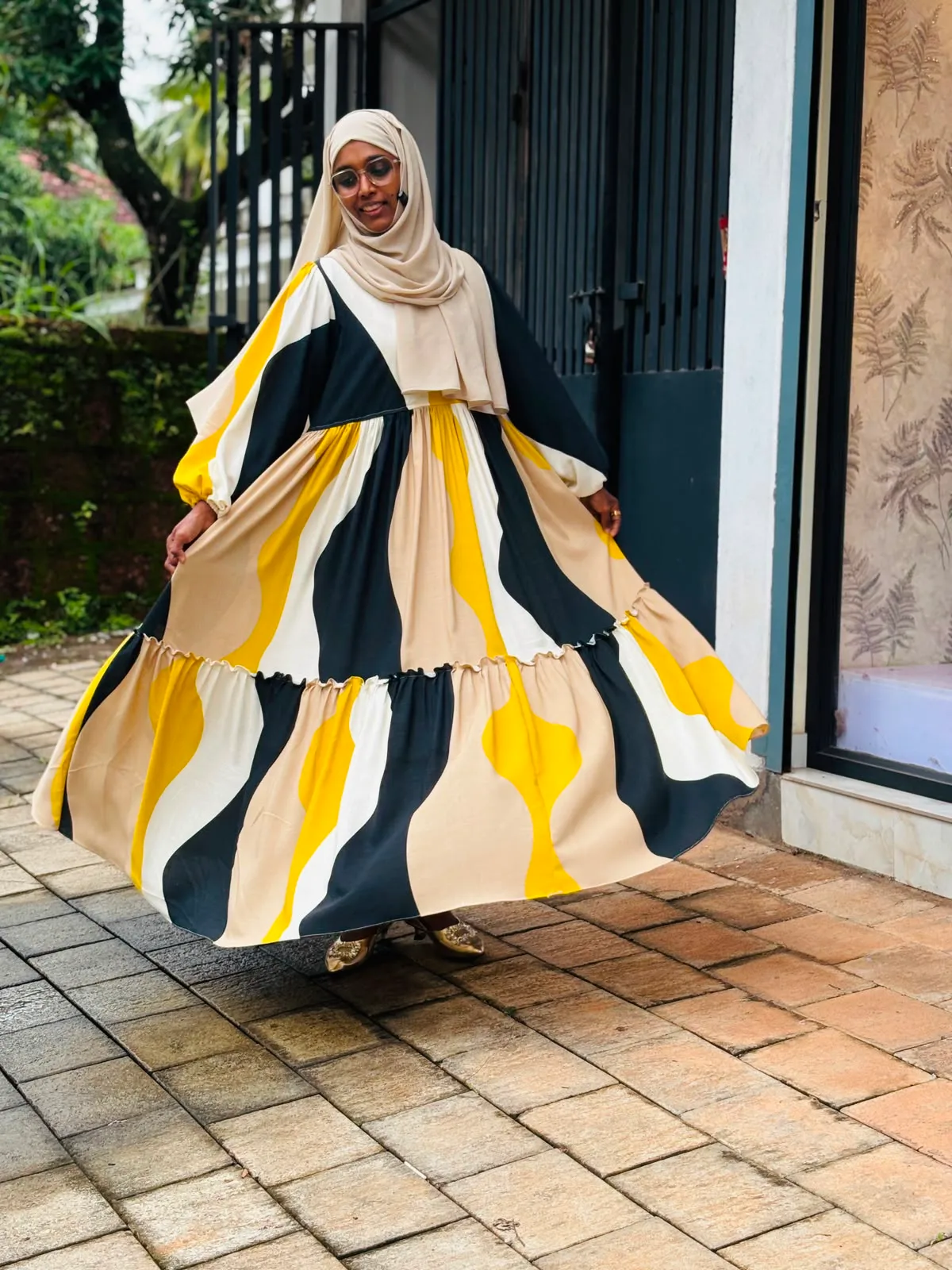 A women wearing a luxury two layer nursing gown online maternity wear in kerala