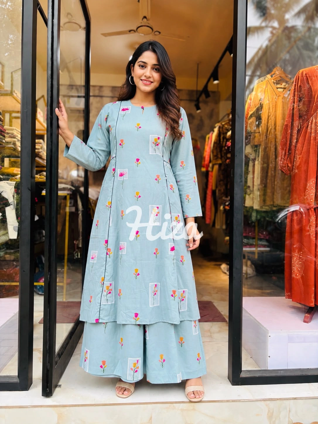 a young women wearing a sky blue color slide pleated maternity wear -online maternity wear in kerala