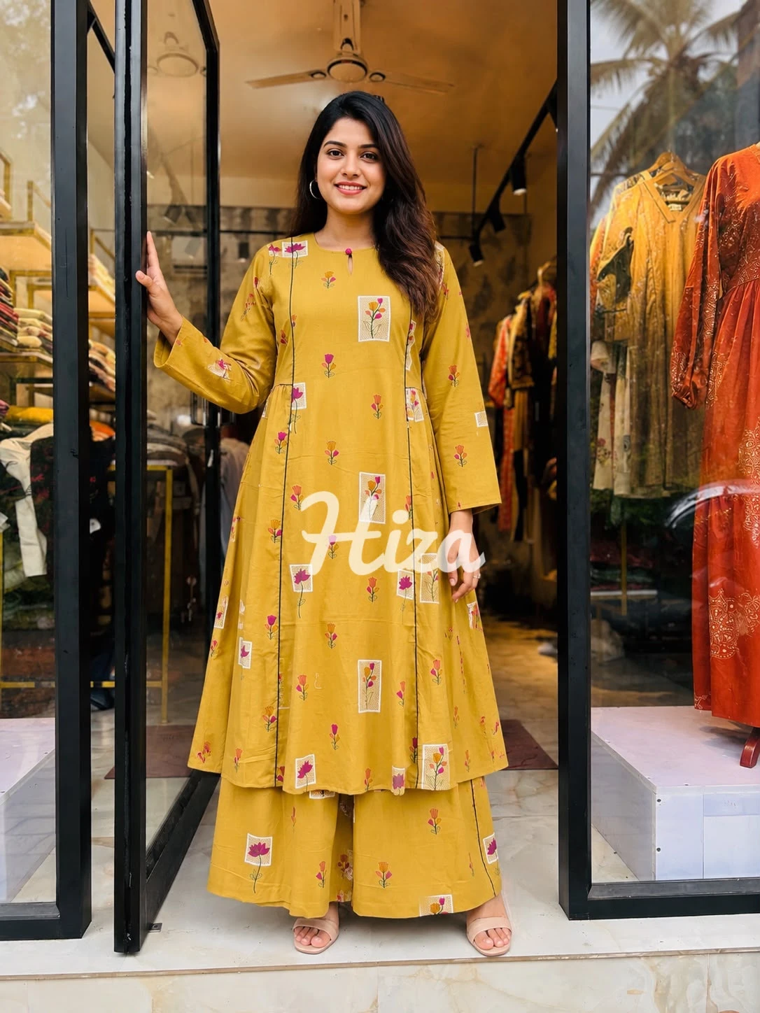 a young women wearing a mustard color slide pleated maternity wear -online maternity wear in kerala