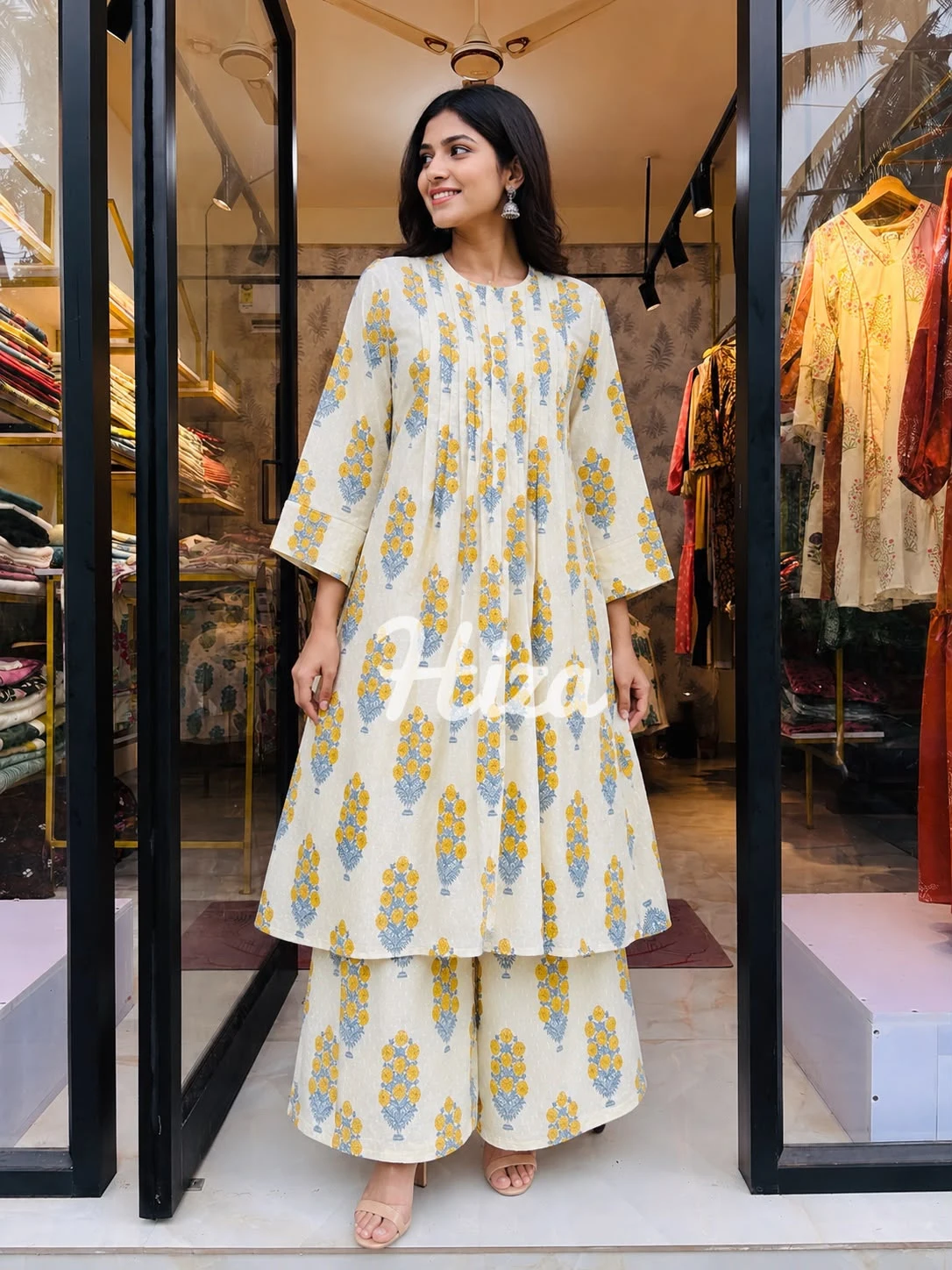 a young women wearing a mustard and off white color feeding co-ord set -online maternity wear in kerala