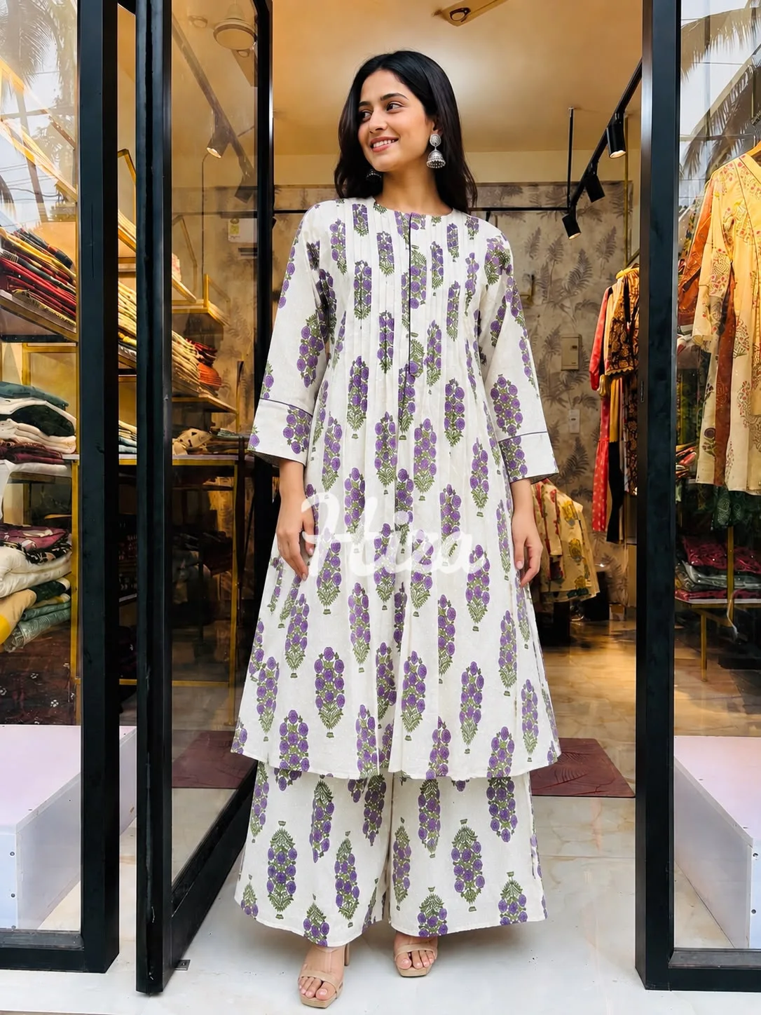 a young women wearing a pintuck center zip co-ord set -online maternity wear in kerala