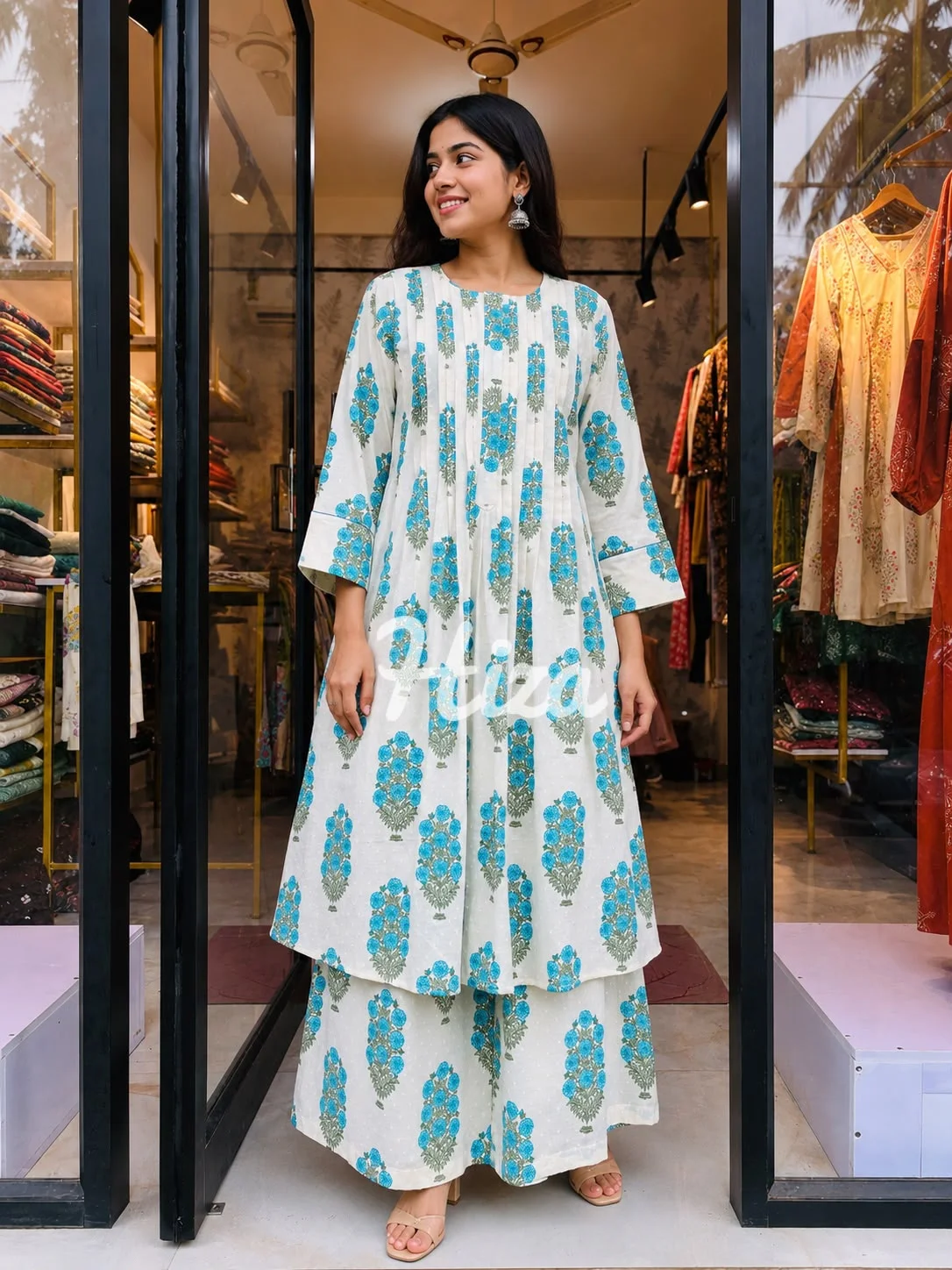 a young women wearing a compinasion co-ord set pin tuck yock-online maternity wearin kerala