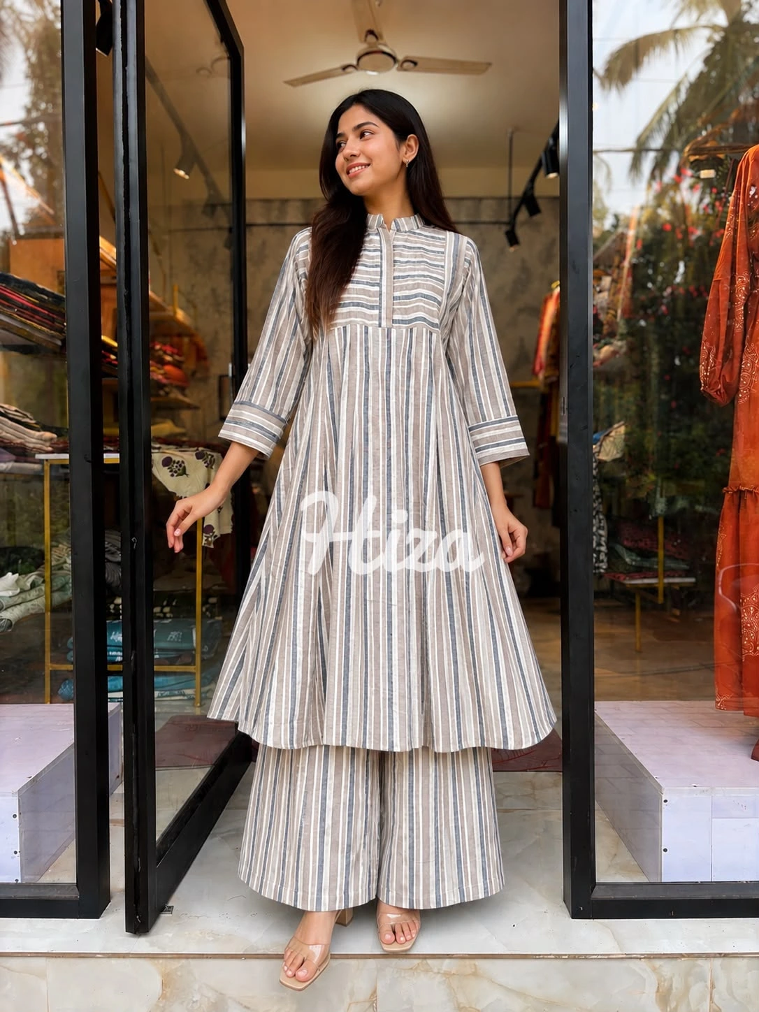 a young women wearing astrip co-ord set with feeding option-online maternity wear in kerala