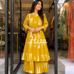 A women wearing a musdtard yellow color nursing cod set online maternity wear in kerala